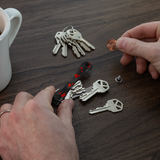 KeySmart Original - Compact Key Holder and Keychain Organiser (Up to 8 Keys) - Red Forged Carbon